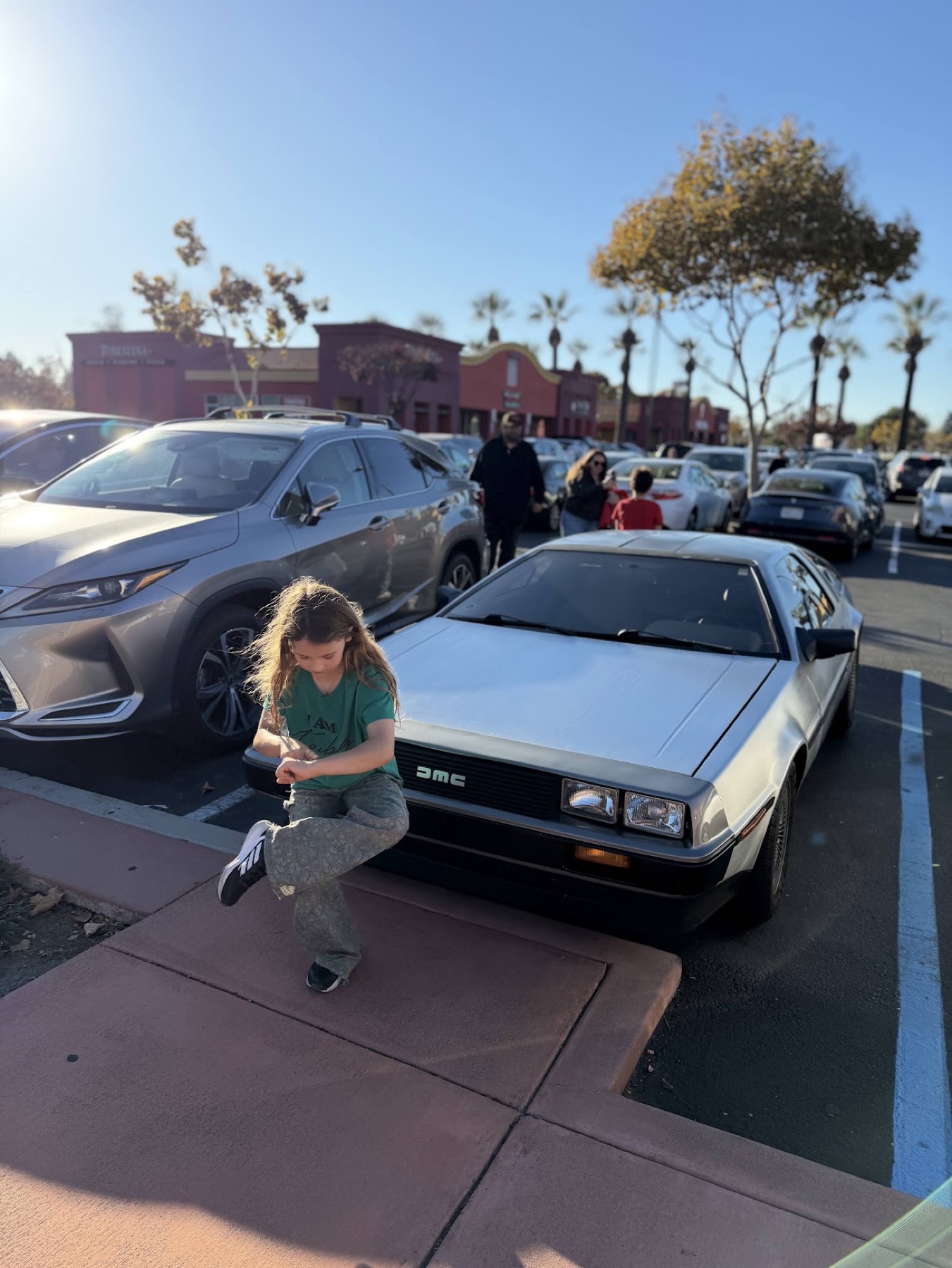 Dancing beside a classic car in the California sun